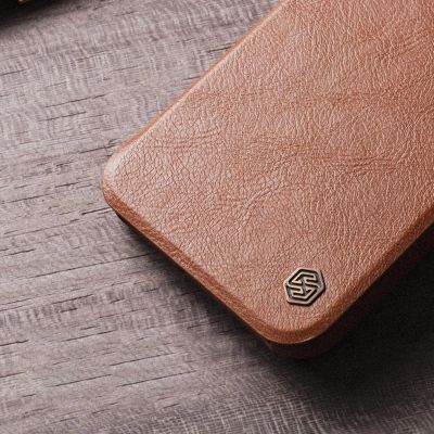 16. Nillkin Qin Leather Pro Case etui iPhone 14 Plus osłona na aparat kabura pokrowiec obudowa z klapką brązowy