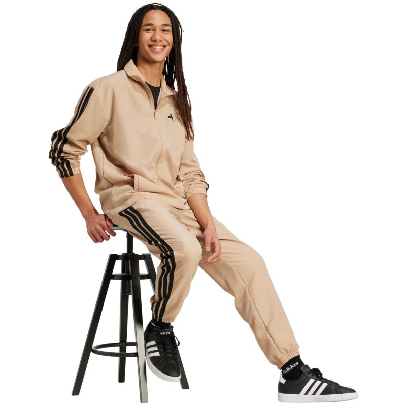 16. Dres męski adidas Sportswear Basic 3-Stripes Woven beżowy JX3149