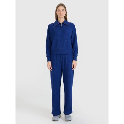 8. Spodnie oversize z szerokimi nogawkami damskie 4F 4FRSS25TTROF1397-31S