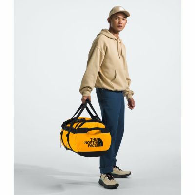 5. Torba base camp duffel m-summit gold-tnf black-npf THE NORTH FACE