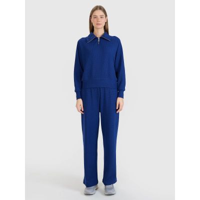 6. Spodnie oversize z szerokimi nogawkami damskie 4F 4FRSS25TTROF1397-31S