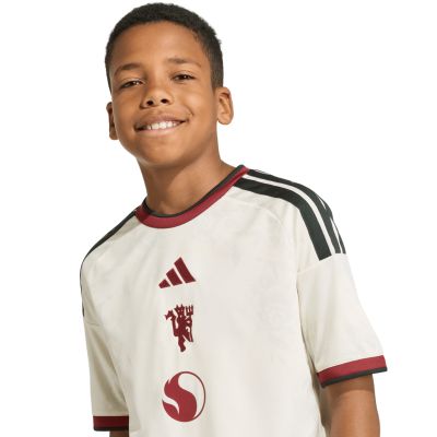 7. Koszulka dla dzieci adidas Manchester United 26/27 Third Jersey beżowa KC4770