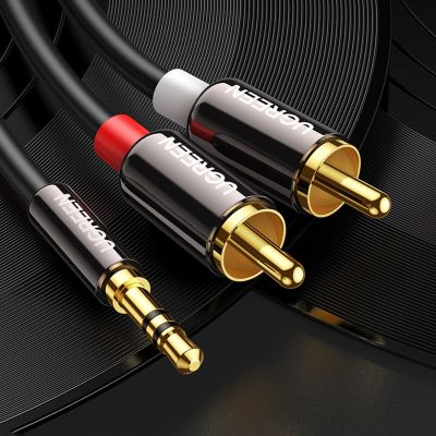 22. Kabel Ugreen AV116 10591 audio mini jack 3,5 mm (męski) / 2RCA (męski) 5m - czarny