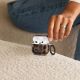 5. Etui Tech-Protect Lamano na AirPods 4 - brązowo-czarne