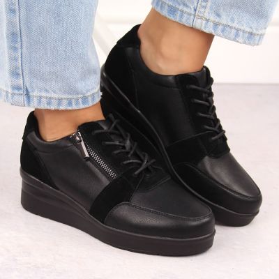 7. Skórzane sneakersy damskie na koturnie czarne Sergio Leone PB236-S