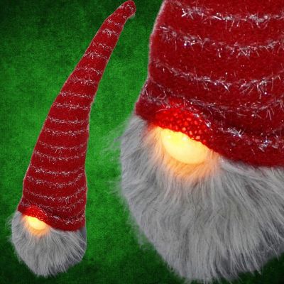 8. SKRZAT Z DŁUGĄ CZERWONĄ CZAPKĄ I ŚWIECĄCYM NOSEM 10x9x42CM